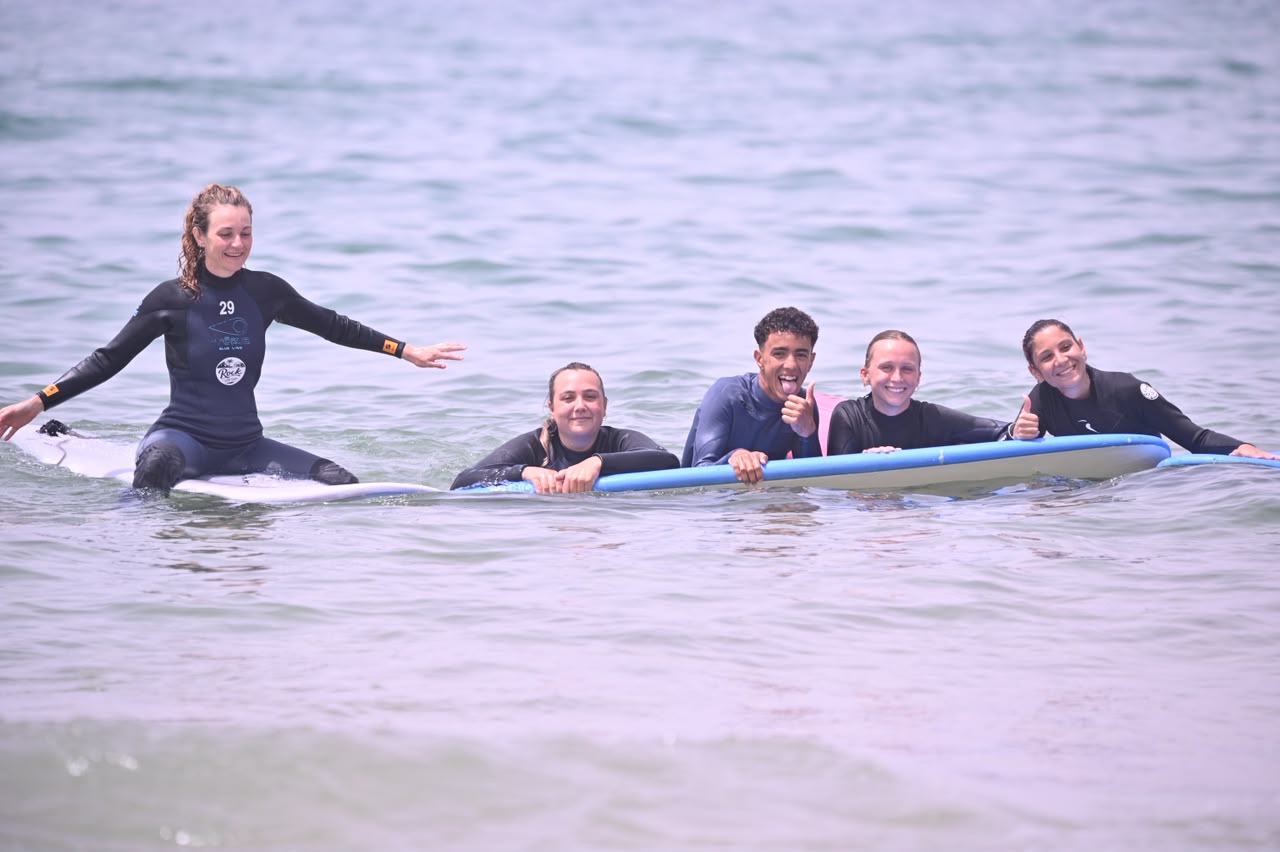 Instructor guiding a group in the shallows